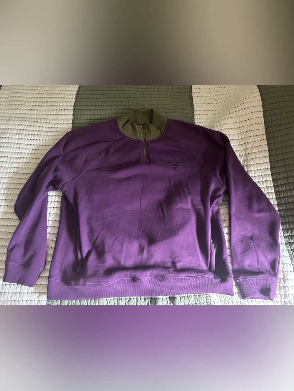 Fabletics The Go-To 1/4 Zip Pullover in a purple and olive.